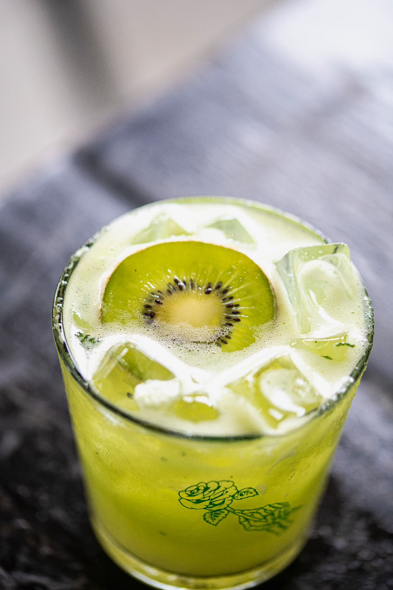 Kiwi cocktail with ice seen from above